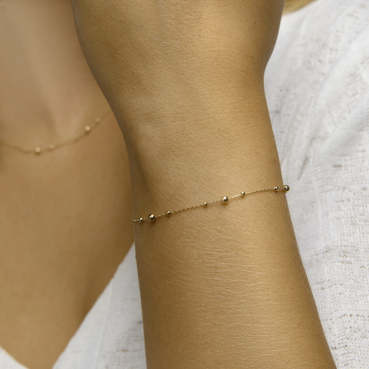 armband bolletjes 0,8 mm 16,5 - 18,5 cm 14K geelgoud