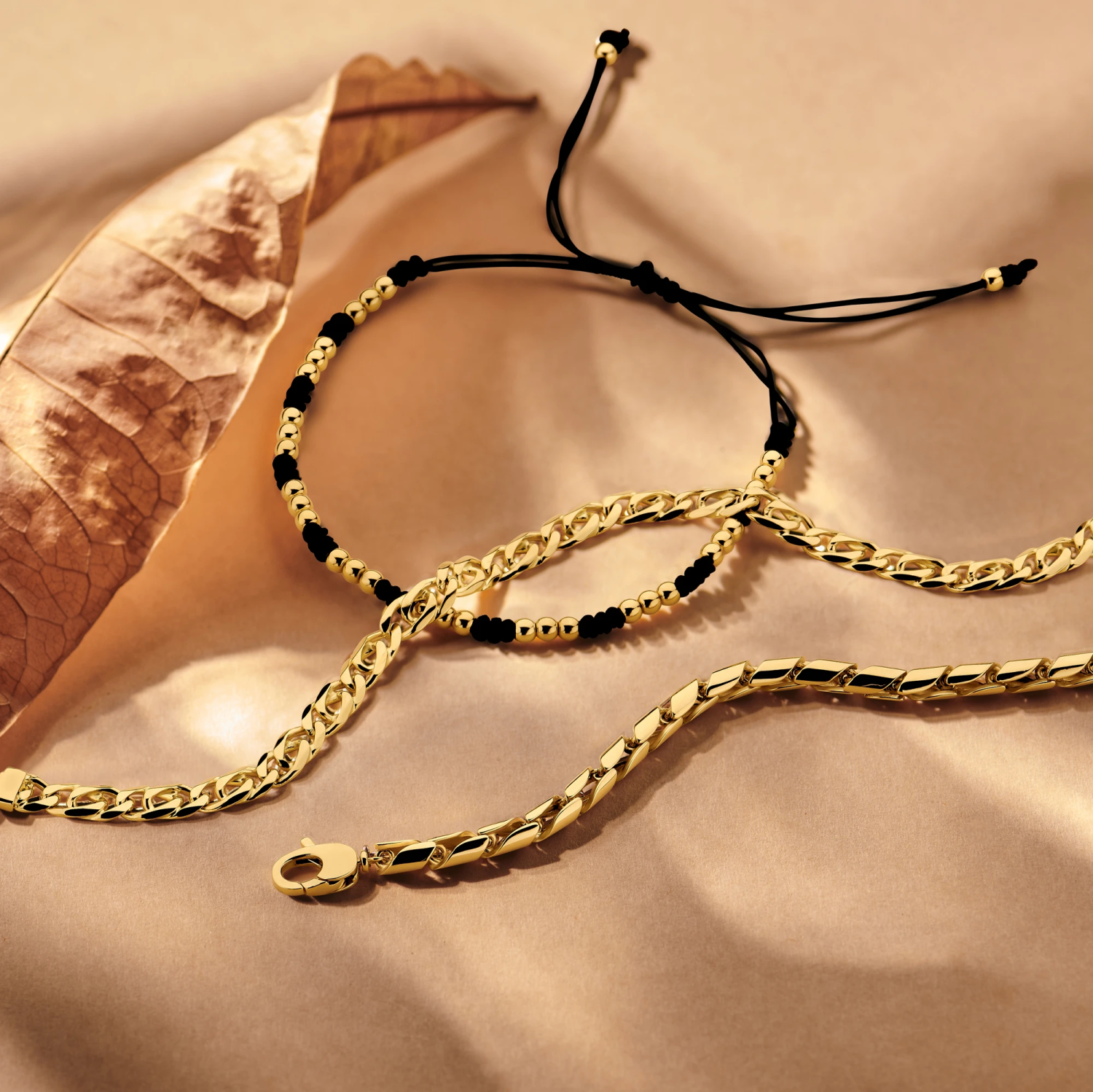 armband bolletjes 13 - 26 cm 14K goud met rubber/nylon/leer