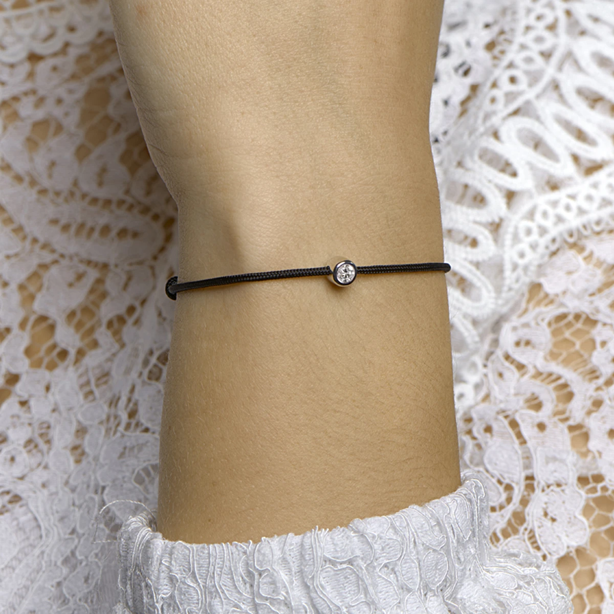 armband katoen rondje zirkonia 15,5 + 2,5 cm zilver gerhodineerd met rubber/nylon/leer