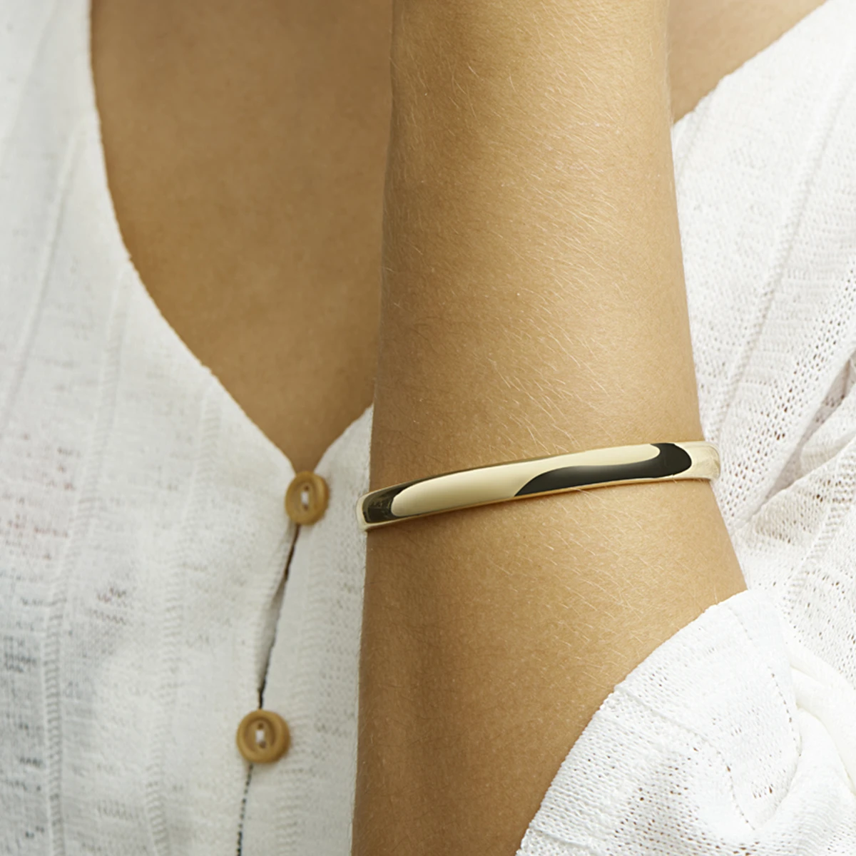 bangle scharnier massief ovale buis 7 mm silgold (geel met zilverkern)