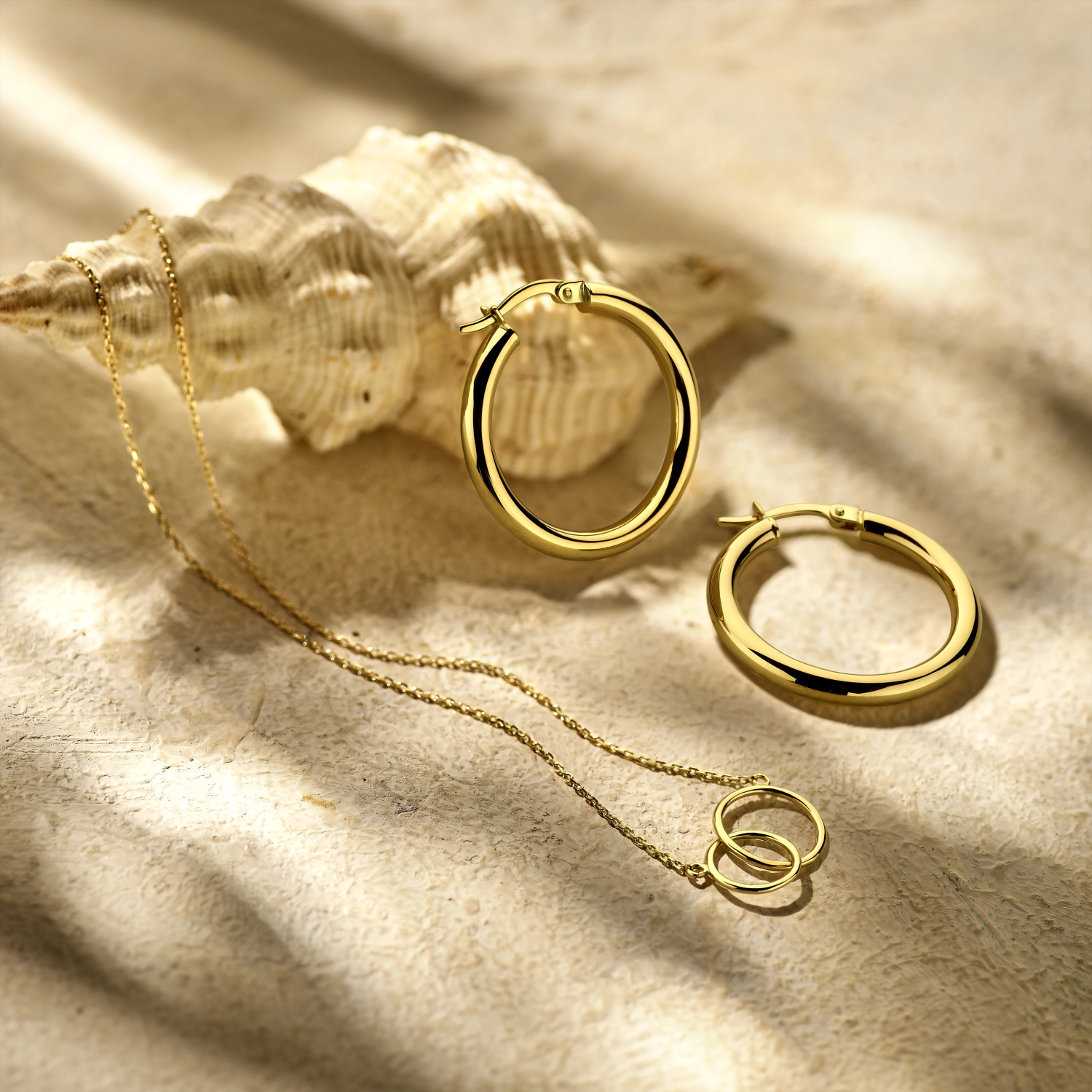 oorringen 3,0 mm ronde buis 14K geelgoud